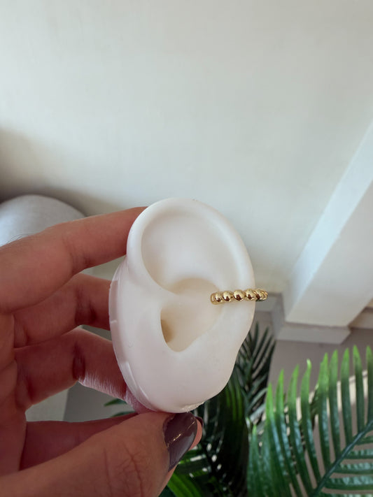 Piercing falso dorado bolitas