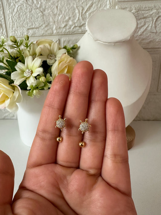 Aretes ortopédicos dobles tortuguitas